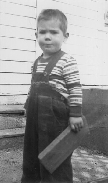 Lawrence Berndt at 3 years old - with board in hand